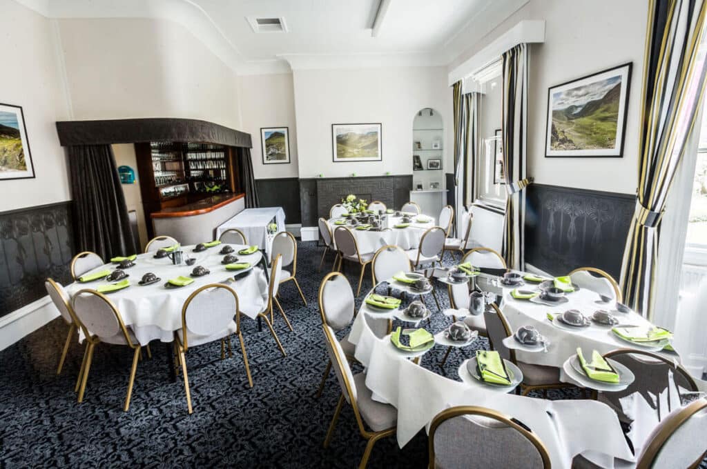 Function room at JW Binks laid out with tables and chairs for a wake